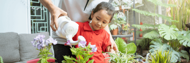 9 - Child watering a garden - Canva