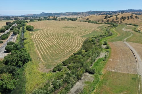 Aerial image of green and golden North Coyote Valley landscape
