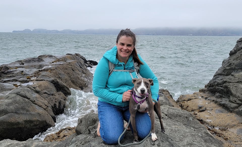 Elizabeth Loretto and her dog, Kali, at the coast