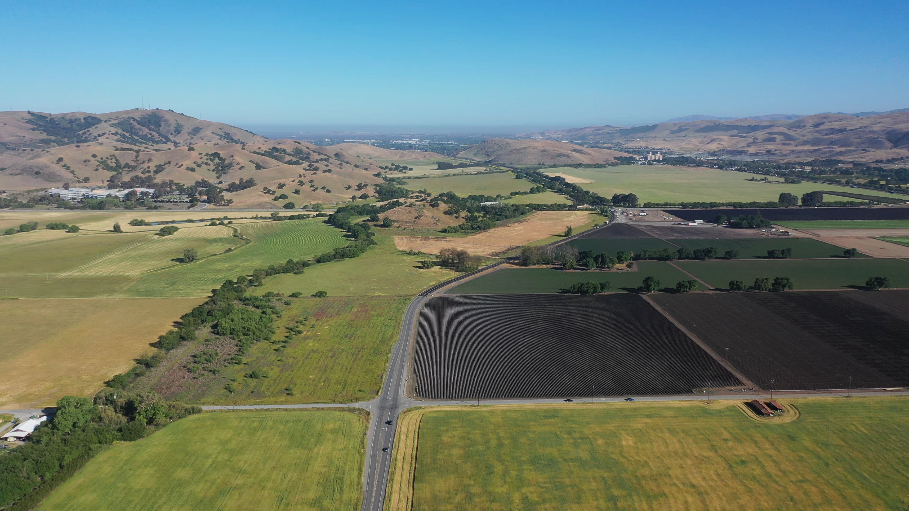 Aerial view of Coyote Valley's open spaces and ag lands, looking north towards San Jose